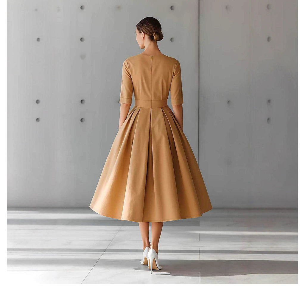 Robe unie à manches trois-quarts, coupe trapèze, style décontracté et élégant, au design personnalisé.